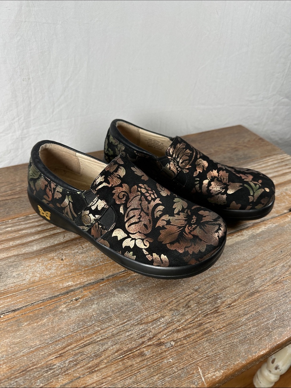 Alegria Black Metallic Floral Slip-On Clogs